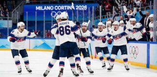 Team USA men's ice hockey players celebrate their thrilling 2-1 overtime gold medal victory against Canada at the 2026 Winter Olympics, dominating today's NHL news.