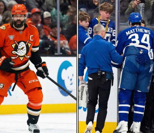 Toronto Maple Leafs captain Auston Matthews down on the ice with a season-ending knee injury following a controversial knee-on-knee hit by Anaheim Ducks captain Radko Gudas.