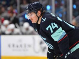 Bobby McMann Trade Rumors: Seattle Kraken & Toronto Maple Leafs News Bobby McMann in a Seattle Kraken jersey getting ready for a faceoff.