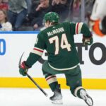 Will the Minnesota Wild Steal Bobby McMann From the Leafs? Bobby McMann of the Toronto Maple Leafs skating on the ice in a mock-up Minnesota Wild jersey is subject of recent NHL trade rumors involving the Wild.