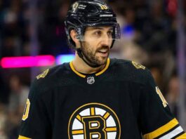 Vincent Trocheck wearing a Boston Bruins jersey amidst NHL trade rumors involving the New York Rangers.