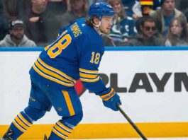 A visualization of St. Louis Blues forward Robert Thomas wearing a blue Buffalo Sabres home jersey and helmet amidst massive NHL trade rumors connecting the two teams.