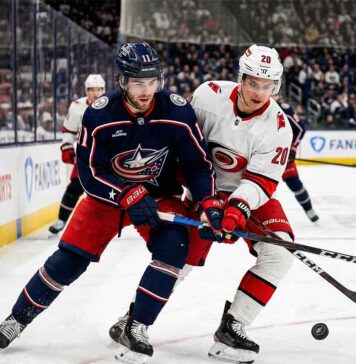 How to Watch Carolina Hurricanes vs Columbus Blue Jackets (Mar 31) Sebastian Aho of the Carolina Hurricanes and Adam Fantilli of the Columbus Blue Jackets battle for the puck on the ice during their NHL game on Tuesday, March 31, 2026.