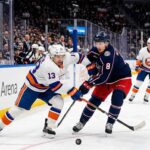 How to Watch Columbus Blue Jackets at New York Islanders on TV & Stream Mathew Barzal (#13) of the New York Islanders and Zach Werenski (#8) of the Columbus Blue Jackets competing for a puck during an NHL game at UBS Arena.