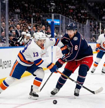 How to Watch Columbus Blue Jackets at New York Islanders on TV & Stream Mathew Barzal (#13) of the New York Islanders and Zach Werenski (#8) of the Columbus Blue Jackets competing for a puck during an NHL game at UBS Arena.