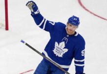 View of superstar Connor McDavid wearing a Toronto Maple Leafs away jersey with number 97, illustrating potential future NHL trade rumors and free agency speculation.