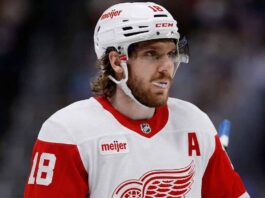 Detroit Red Wings Trade Rumors: Why They Passed on Robert Thomas Concept image depicting NHL star Robert Thomas wearing a white Detroit Red Wings away uniform and helmet with visor, visualizing the potential trade acquisition from the St. Louis Blues that Steve Yzerman passed on before the 2026 trade deadline.