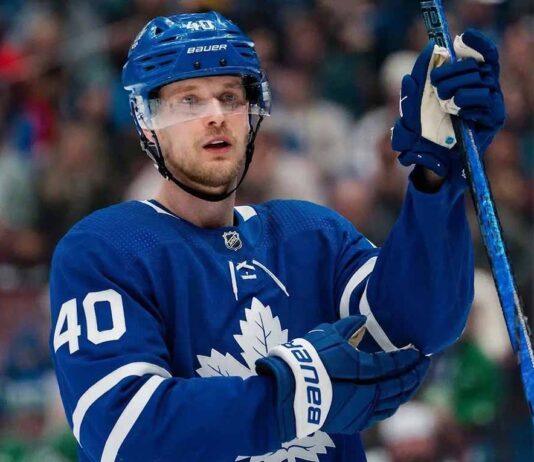 A jersey swap photo illustration of Elias Pettersson wearing a Toronto Maple Leafs home uniform, visually representing the rumored blockbuster trade from the Vancouver Canucks.