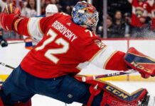 Florida Panthers goaltender Sergei Bobrovsky (72) makes a dramatic full-split save against Edmonton Oilers star Connor McDavid during a high-stakes NHL game. Bobrovsky is wearing his signature red Panthers uniform and CCM goalie gear.