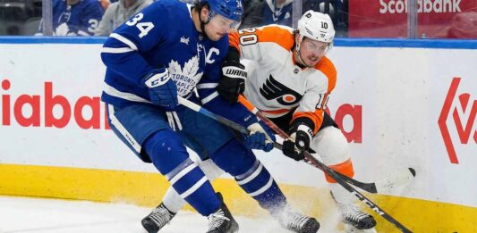 Will the Maple Leafs Survive the Flyers? TV Options & Odds Auston Matthews of the Toronto Maple Leafs and Travis Konecny of the Philadelphia Flyers battle for the puck along the boards during an NHL game.