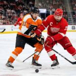 What Channel is the Flyers vs. Red Wings Game On? | March 28, 2026 Philadelphia Flyers’ Travis Konecny battles for the puck against Detroit Red Wings captain Dylan Larkin during their March 28, 2026 matchup at Little Caesars Arena.