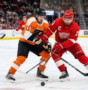 What Channel is the Flyers vs. Red Wings Game On? | March 28, 2026 Philadelphia Flyers’ Travis Konecny battles for the puck against Detroit Red Wings captain Dylan Larkin during their March 28, 2026 matchup at Little Caesars Arena.