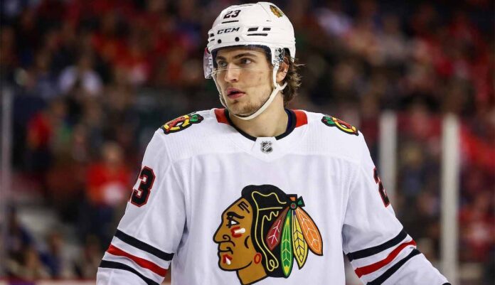 A detailed jersey swap visualization showing Toronto Maple Leafs forward Matthew Knies wearing a white Chicago Blackhawks uniform with number 23, illustrating NHL trade rumors between the two teams.