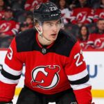 Toronto Maple Leafs & New Jersey Devils Trade Rumors: Matthew Knies "New Jersey Devils trade target Matthew Knies in a red Devils jersey with number 23 and black helmet, looking focused on the ice.