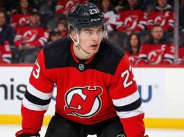 Toronto Maple Leafs & New Jersey Devils Trade Rumors: Matthew Knies "New Jersey Devils trade target Matthew Knies in a red Devils jersey with number 23 and black helmet, looking focused on the ice.