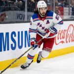 Mika Zibanejad Trade Rumors | New York Rangers Offseason Outlook New York Rangers forward Mika Zibanejad (93) skating with the puck along the boards during an NHL game.