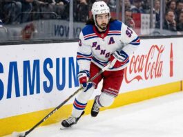 Mika Zibanejad Trade Rumors | New York Rangers Offseason Outlook New York Rangers forward Mika Zibanejad (93) skating with the puck along the boards during an NHL game.