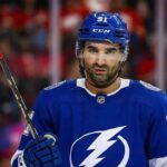 Tampa Bay Lightning Kadri Trade: Is a Blockbuster Brewing? Calgary Flames center Nazem Kadri (91) wears a Tampa Bay Lightning jersey and helmet.