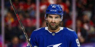Calgary Flames center Nazem Kadri (91) wears a Tampa Bay Lightning jersey and helmet.