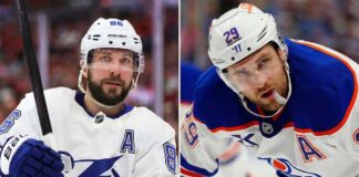 A side-by-side split portrait image featuring Nikita Kucherov #86 of the Tampa Bay Lightning on the left, and Leon Draisaitl #29 of the Edmonton Oilers on the right. Both players are in white away jerseys with the "A" patch during a game. This photo represents the top NHL news makers of March 18, 2026.