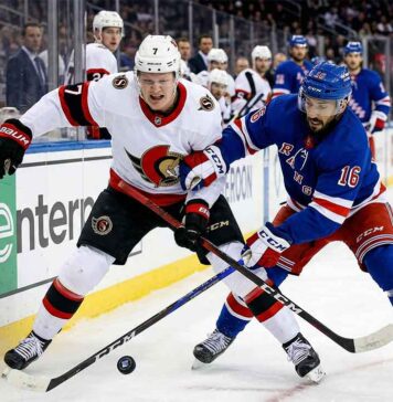 How to Watch Ottawa Senators vs New York Rangers on TV Close-up action photograph capturing Ottawa Senators' captain Brady Tkachuk (#7) and New York Rangers' center Vincent Trocheck (#16) intensely battling for the puck during an NHL game, with a blurred background of spectators and arena boards.