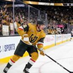 Vegas Golden Knights forward Pavel Dorofeyev (jersey #16) controls the puck while skating during an NHL home game.