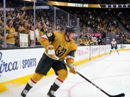 Vegas Golden Knights forward Pavel Dorofeyev (jersey #16) controls the puck while skating during an NHL home game.