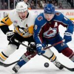 Cale Makar (8) of the Colorado Avalanche battles Evgeni Malkin (71) of the Pittsburgh Penguins for the puck during a high-stakes NHL game on March 16, 2026.