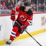 New Jersey Devils defenseman Simon Nemec (17) skating with the puck during an NHL game, amid trade deadline rumors.