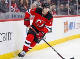 New Jersey Devils defenseman Simon Nemec (17) skating with the puck during an NHL game, amid trade deadline rumors.