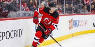 New Jersey Devils defenseman Simon Nemec (17) skating with the puck during an NHL game, amid trade deadline rumors.