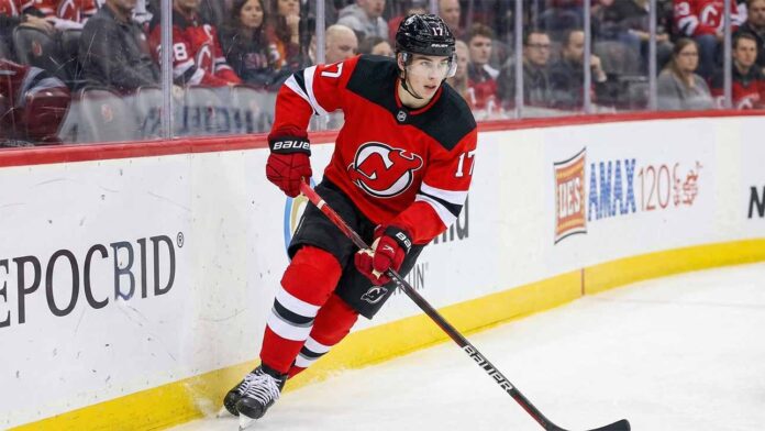 New Jersey Devils defenseman Simon Nemec (17) skating with the puck during an NHL game, amid trade deadline rumors.