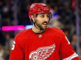 The Trade Package the New York Rangers Want for Vincent Trocheck Photo illustration showing New York Rangers center Vincent Trocheck wearing a Detroit Red Wings jersey on the ice amid recent NHL trade rumors linking him to the team.