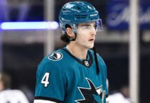 New York Rangers defenseman Braden Schneider pictured in a teal San Jose Sharks uniform, visualizing NHL trade rumors amid NYR rebuild.