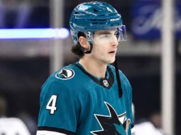New York Rangers defenseman Braden Schneider pictured in a teal San Jose Sharks uniform, visualizing NHL trade rumors amid NYR rebuild.
