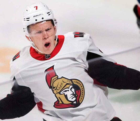 Ottawa Senators forward Brady Tkachuk looking determined on the ice, amid NHL trade rumors linking him to the New Jersey Devils.