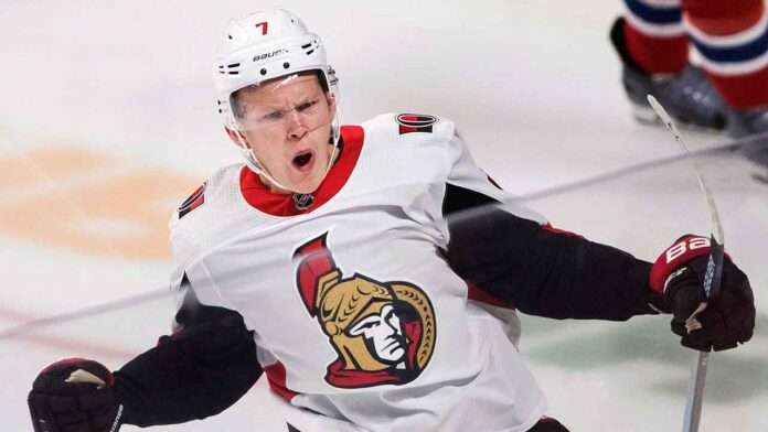 Ottawa Senators forward Brady Tkachuk looking determined on the ice, amid NHL trade rumors linking him to the New Jersey Devils.