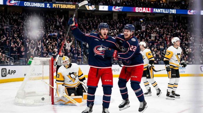 Columbus Blue Jackets (CBJ) young stars Adam Fantilli and Cole Sillinger celebrate after scoring a goal against the Pittsburgh Penguins.