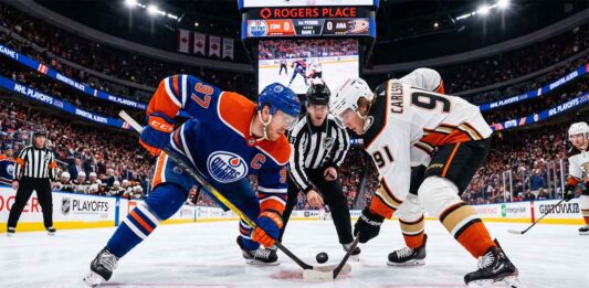 Edmonton Oilers captain Connor McDavid (#97) and Anaheim Ducks center Leo Carlsson (#91) taking a face-off at center ice during NHL Playoffs Game 1 at Rogers Place.