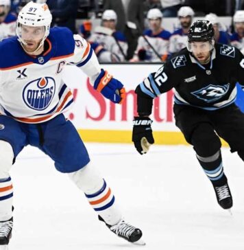 Edmonton Oilers vs Utah Mammoth TV Channel & Stream (April 7) Edmonton Oilers captain Connor McDavid (#97) battles Utah Mammoth forward Kevin Stenlund (#82) for the puck during an intense NHL Western Conference matchup at the Delta Center on April 7, 2026.