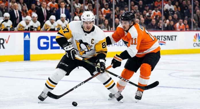 Intense puck battle between Pittsburgh Penguins captain Sidney Crosby (#87) and Philadelphia Flyers forward Travis Konecny (#11) during an NHL Stanley Cup Playoff game.