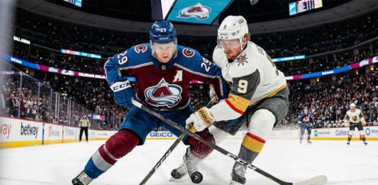 How to Watch Vegas Golden Knights vs Colorado Avalanche: TV & Stream A dynamic photo of Colorado Avalanche center Nathan MacKinnon (#29) battling Vegas Golden Knights center Jack Eichel (#9) for puck possession during a high-stakes NHL game at Ball Arena.