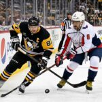 How to Watch Pittsburgh Penguins at Washington Capitals | TV Channels & Stream Sidney Crosby of the Pittsburgh Penguins battles Alex Ovechkin of the Washington Capitals for the puck during their April 11, 2026 NHL game.