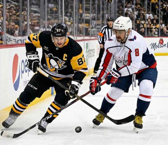 How to Watch Pittsburgh Penguins at Washington Capitals | TV Channels & Stream Sidney Crosby of the Pittsburgh Penguins battles Alex Ovechkin of the Washington Capitals for the puck during their April 11, 2026 NHL game.