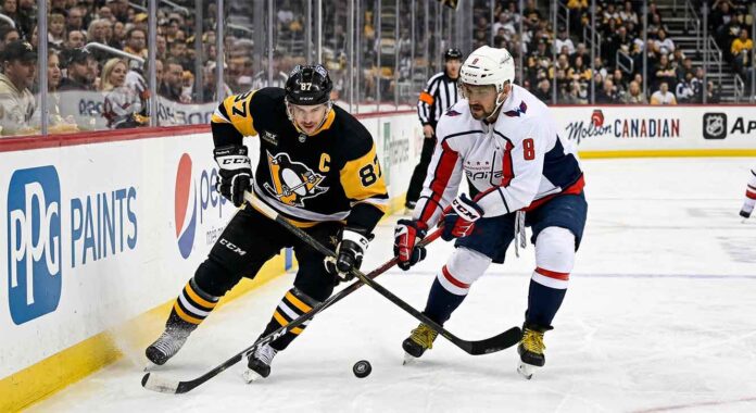 how-to-watch-avs-golden-knights-april-12-2026 Sidney Crosby of the Pittsburgh Penguins battles Alex Ovechkin of the Washington Capitals for the puck during their April 11, 2026 NHL game.