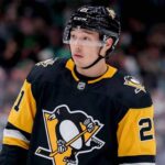 A mockup image of Dallas Stars forward Jason Robertson wearing a black and gold Pittsburgh Penguins hockey jersey.