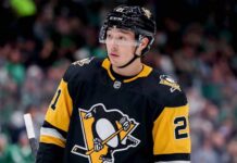 Pittsburgh Penguins Trade Rumors: Will They Acquire Jason Robertson from Dallas Stars? A mockup image of Dallas Stars forward Jason Robertson wearing a black and gold Pittsburgh Penguins hockey jersey.