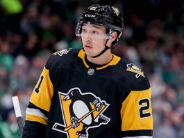 A mockup image of Dallas Stars forward Jason Robertson wearing a black and gold Pittsburgh Penguins hockey jersey.