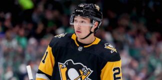 A mockup image of Dallas Stars forward Jason Robertson wearing a black and gold Pittsburgh Penguins hockey jersey.