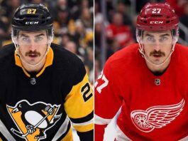 A close-up portrait of hockey player Mason Marchment with intense blue eyes and a mustache, wearing a white Seattle Kraken jersey, who is currently a pending UFA for the Columbus Blue Jackets and a target for the Pittsburgh Penguins and Detroit Red Wings in NHL free agency.